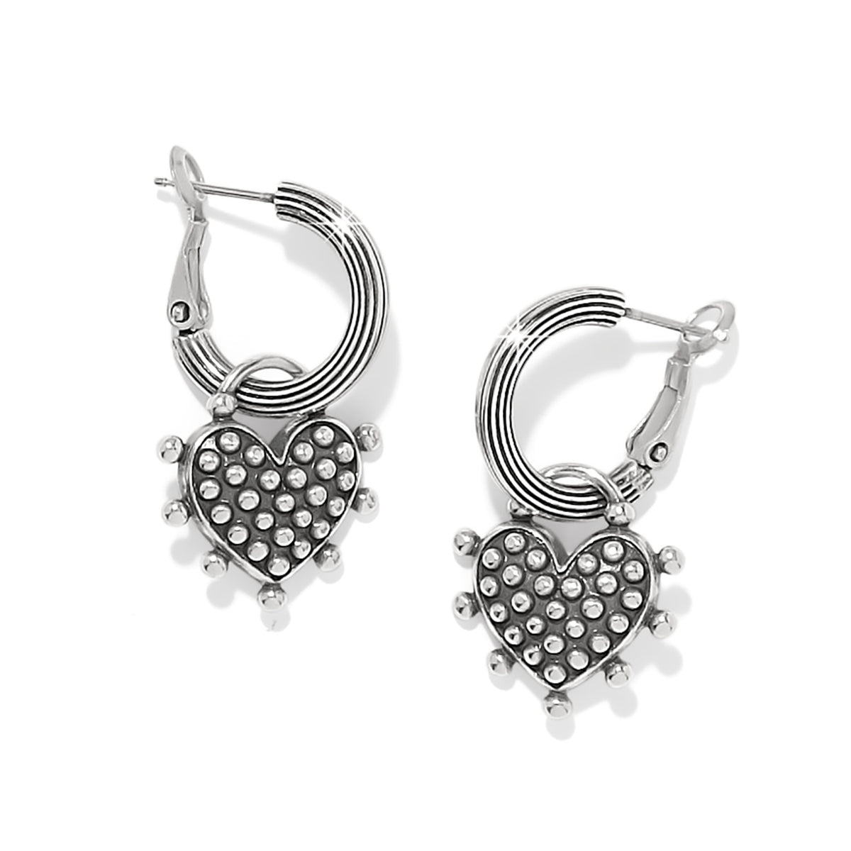 Silver plated reversible charm hoop earrings with a sweet heart pendant on post backs.