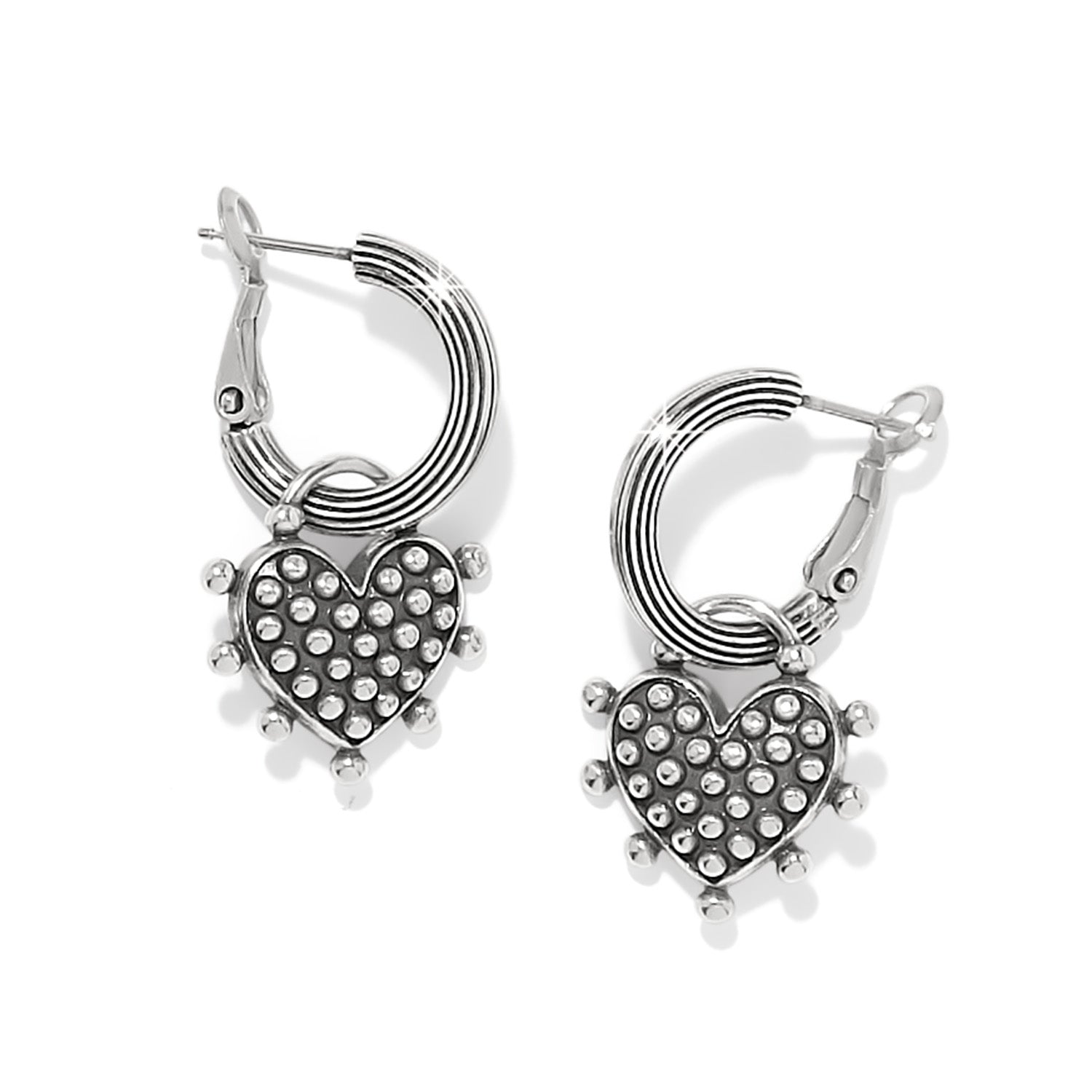 Silver plated reversible charm hoop earrings with a sweet heart pendant on post backs.