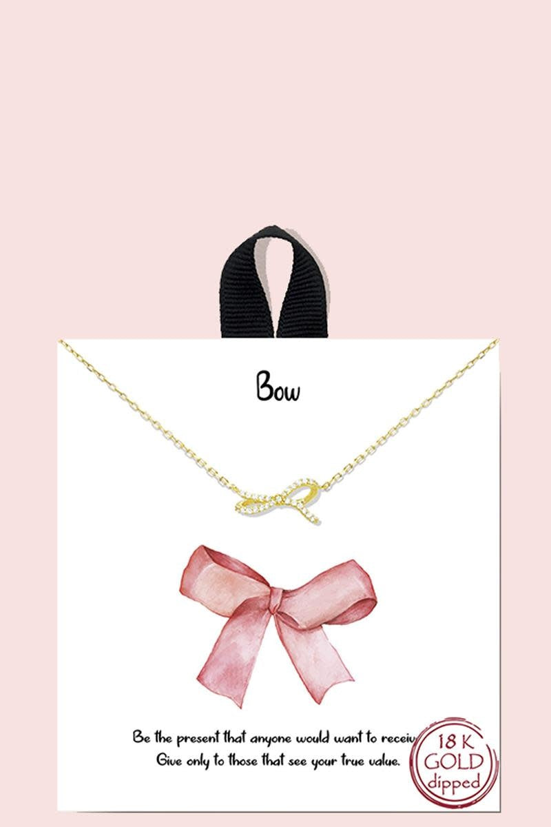 Gold crystal ribbon bow necklace on a chain