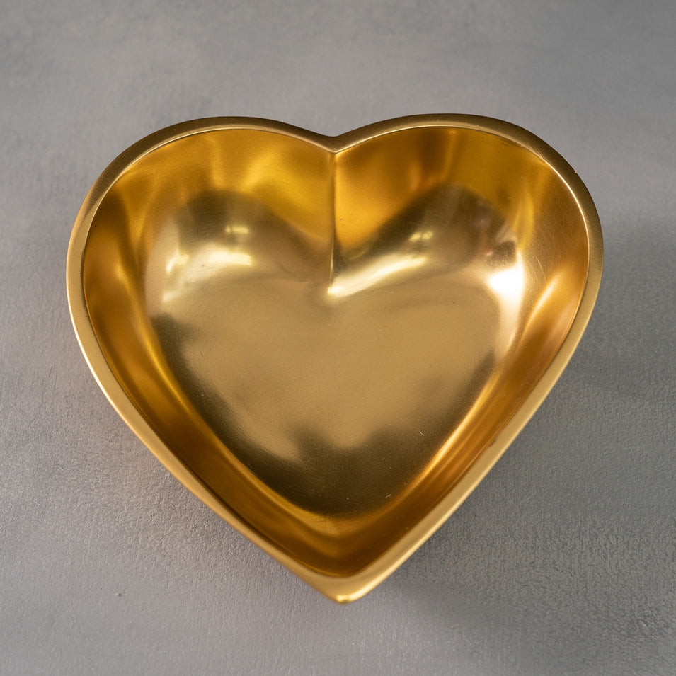 Large heart-shaped bowl with a polished gold finish, crafted from aluminum.