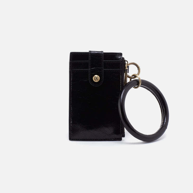Black leather credit card wristlet with brass hardware and removable handle