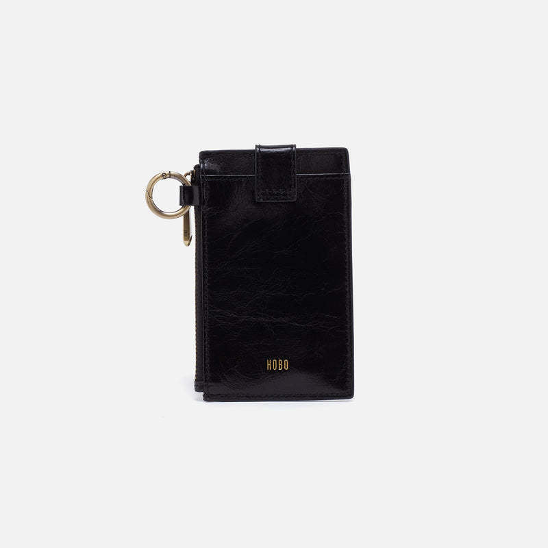 Black leather credit card wristlet with brass hardware and removable handle
