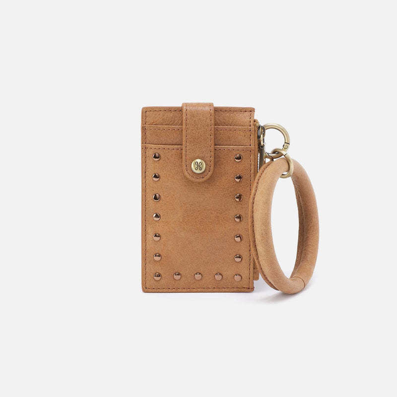 Whiskey buffed leather ring credit card wristlet with micro stud detailing.