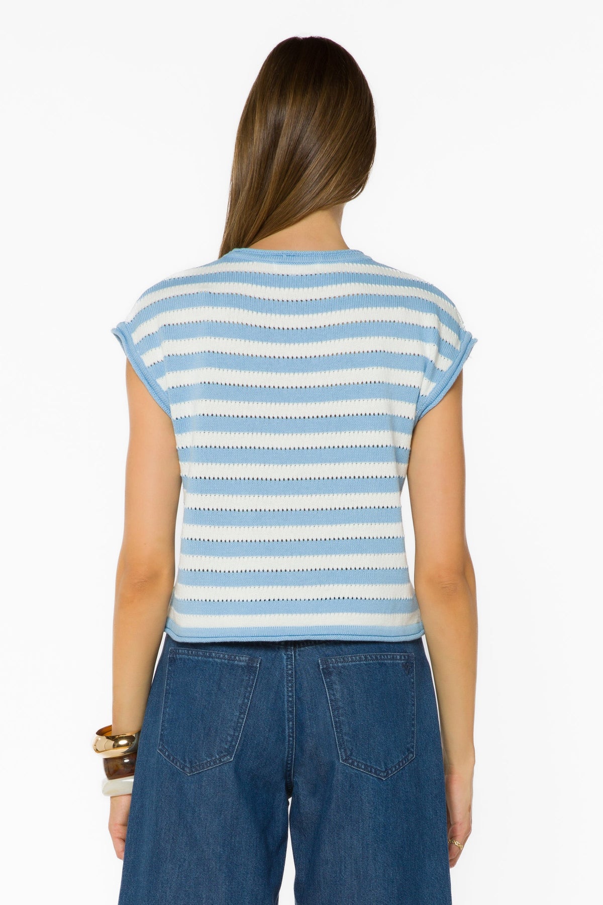 Back view of a woman wearing the Abree Optic White and blue striped short sleeve knit sweater.