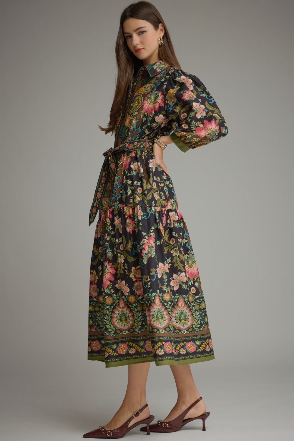 Woman wearing the Chloe Printed ¾ Balloon Sleeve Midi Dress with a floral pattern and waist tie.