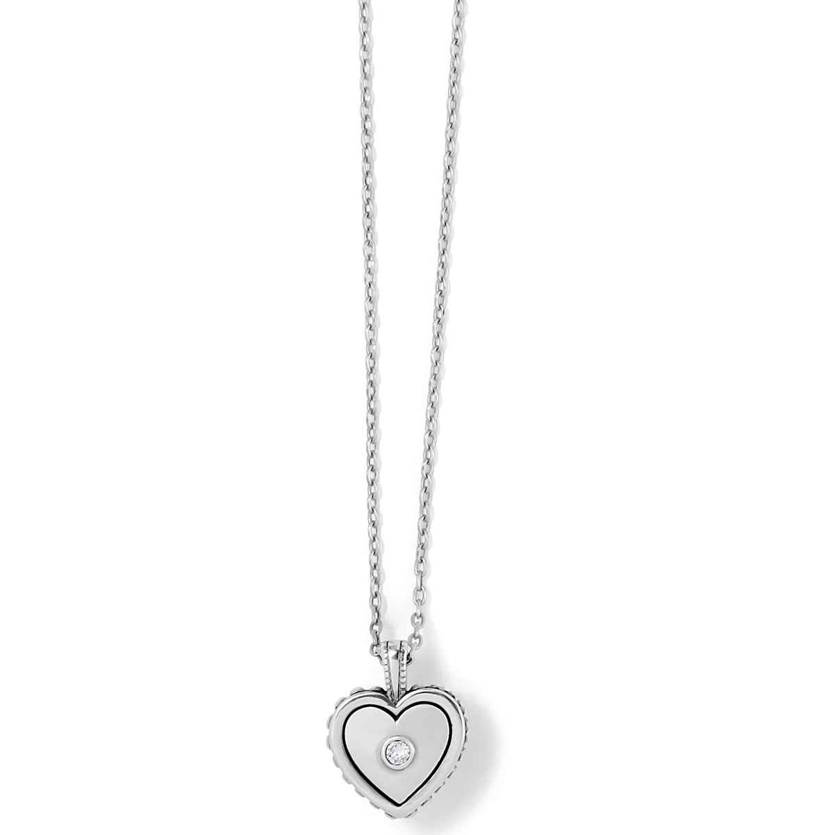 Silver plated petite heart pendant necklace with sculpted studding and a crystal center.