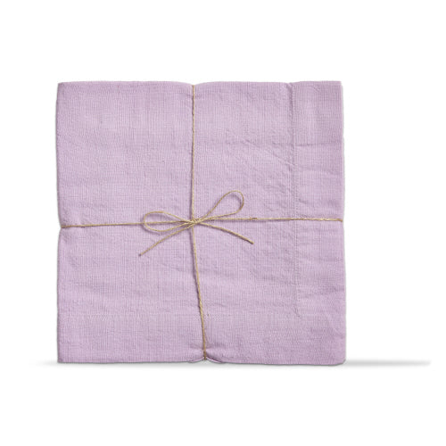 Set of light purple slub-textured napkins tied with a simple twine bow.