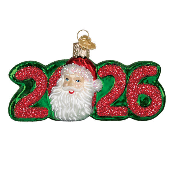 Red glass Santa ornament with white beard and black hat standing on a gold base.