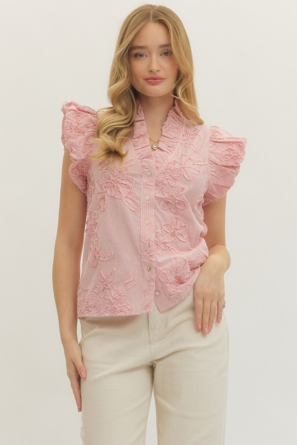 Leslie striped cotton top with floral appliqué, ruffled mock neck, flutter sleeves in light blue.