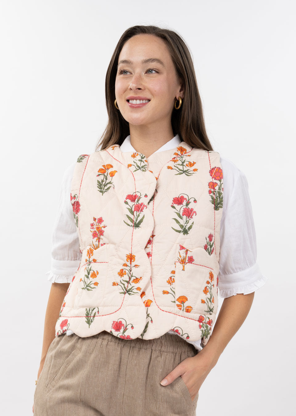 Quilted scallop-edge vest in light beige with a relaxed fit silhouette.