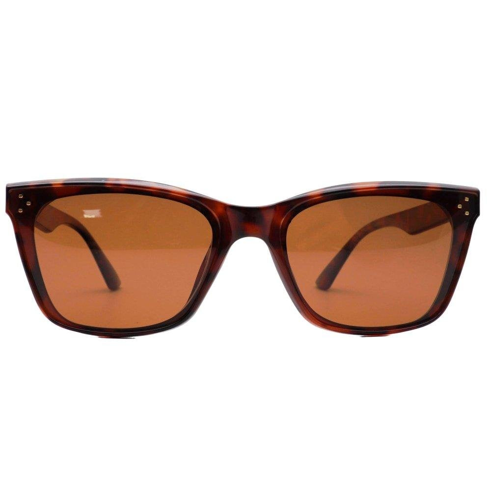 Kiki Tort brown polarized lens sunglasses with a tortoiseshell pattern frame and dark tinted lenses.