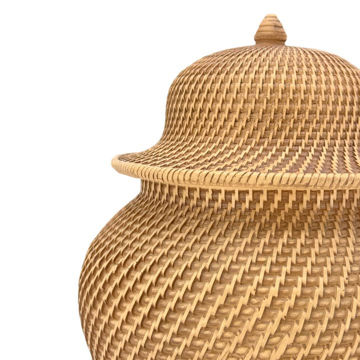 Close-up of a faux wicker ginger jar made of polyresin with an intricate basket-weave texture.