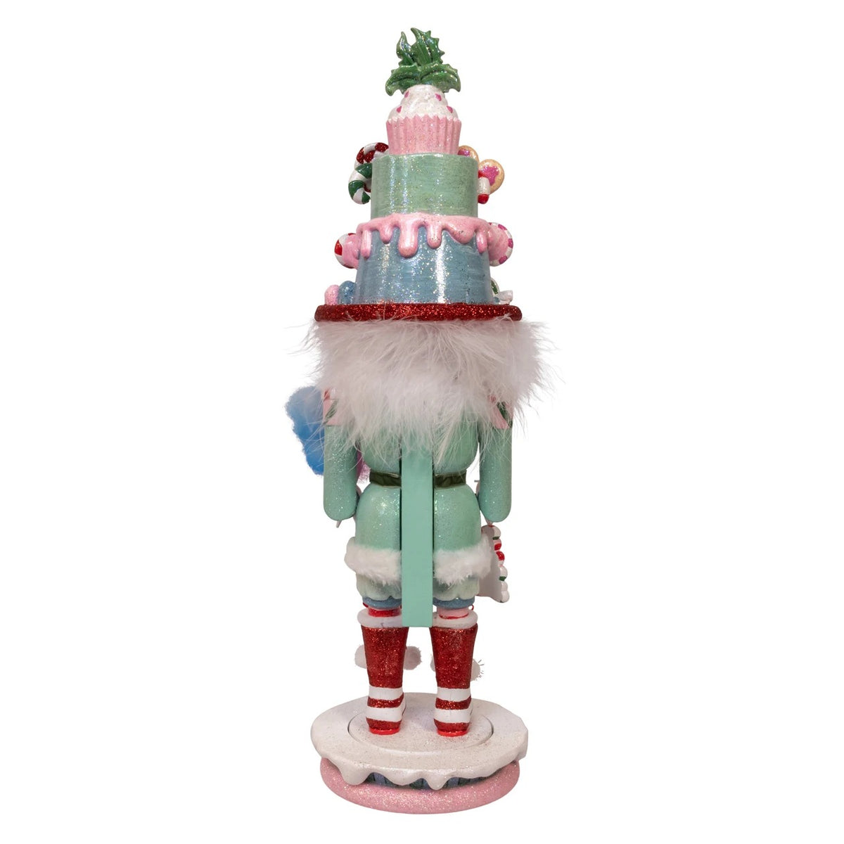 Back view of an 18-inch Hollywood Nutcracker with a tiered candy hat and red glitter boots.