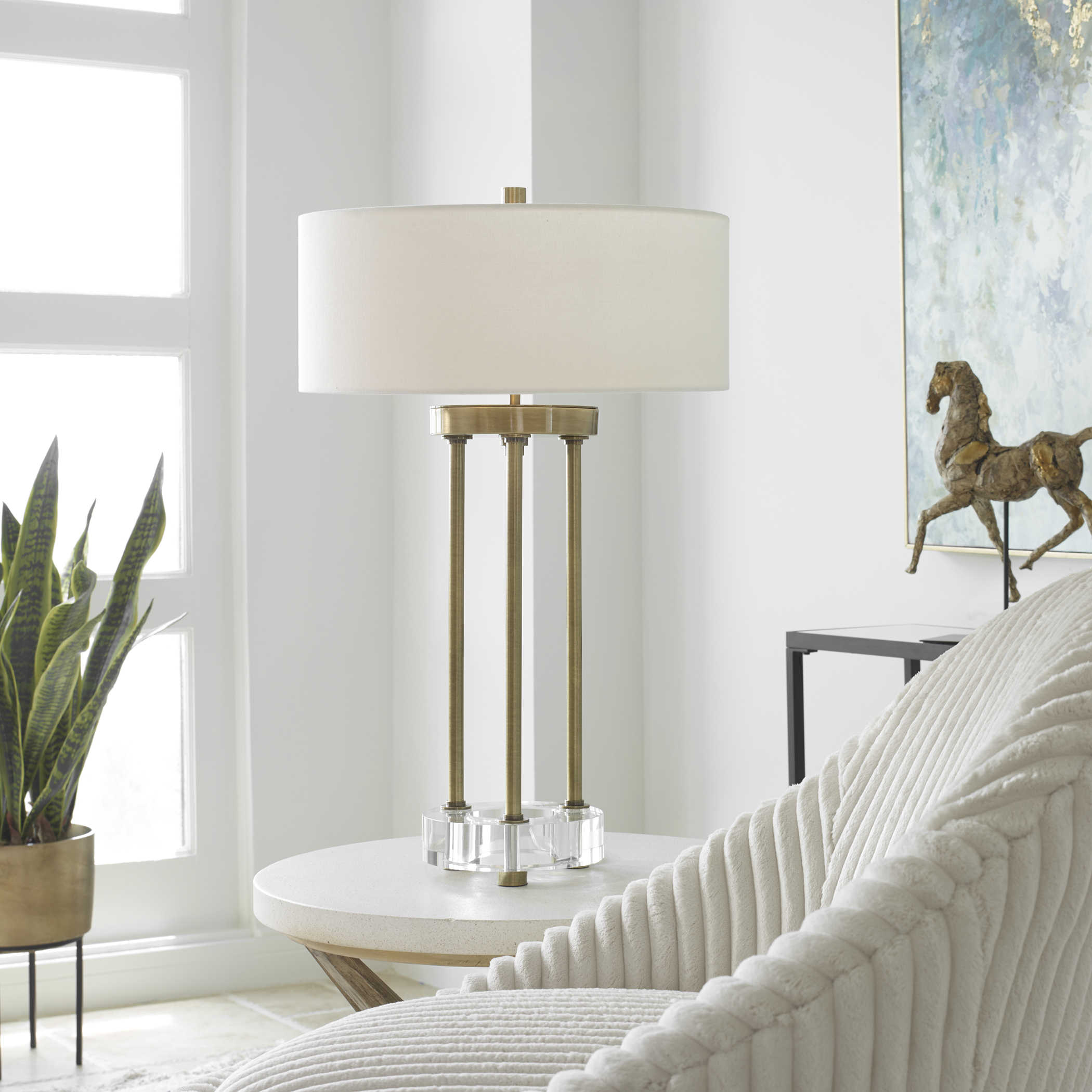Pantheon table lamp with a cylindrical shade in neutral tones.