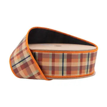 1 1/2 inch wired dupioni fall plaid ribbon with an orange edge and black backing on a spool.