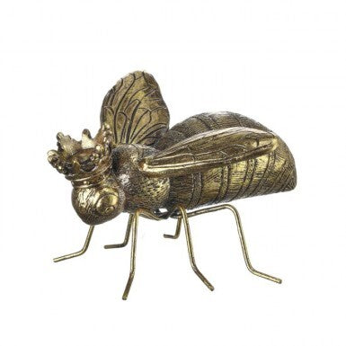 A golden bee figurine wearing a crown, with detailed wings and body.