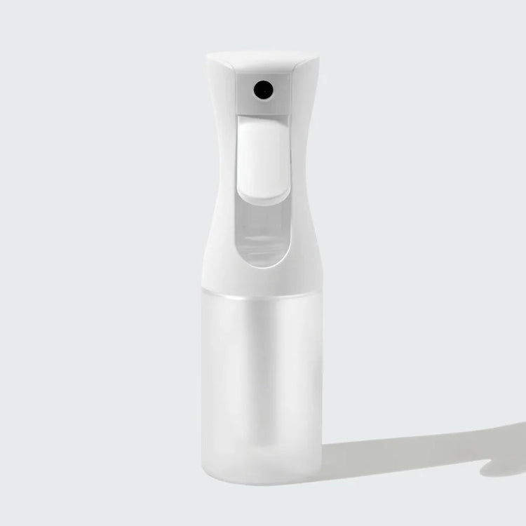 White recycled plastic continuous spray bottle with a compact cylindrical body.