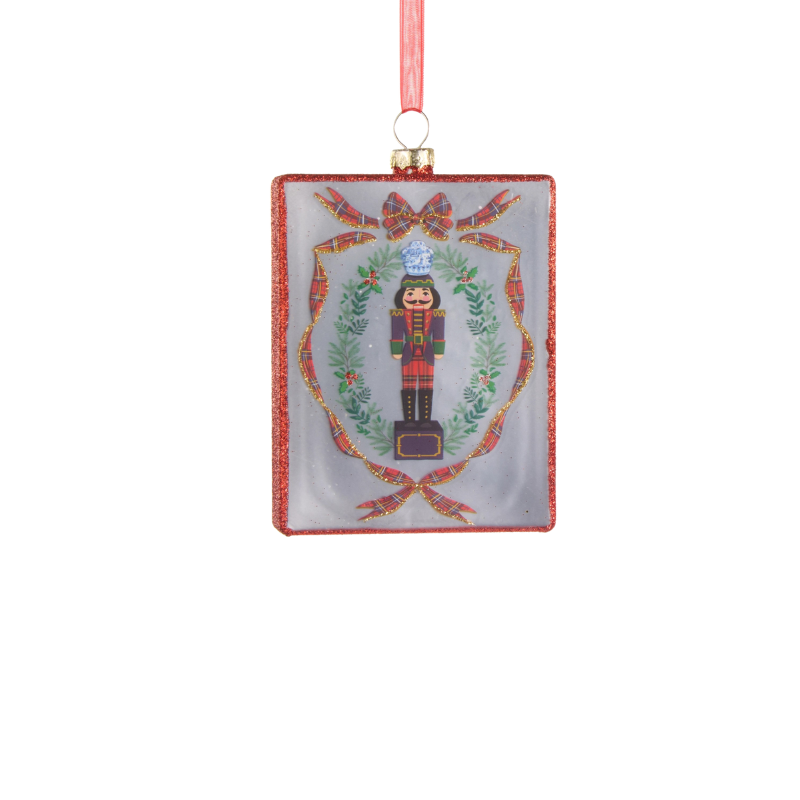 4.5-inch glass rectangle ornament featuring a nutcracker inside a wreath with plaid ribbon accents.