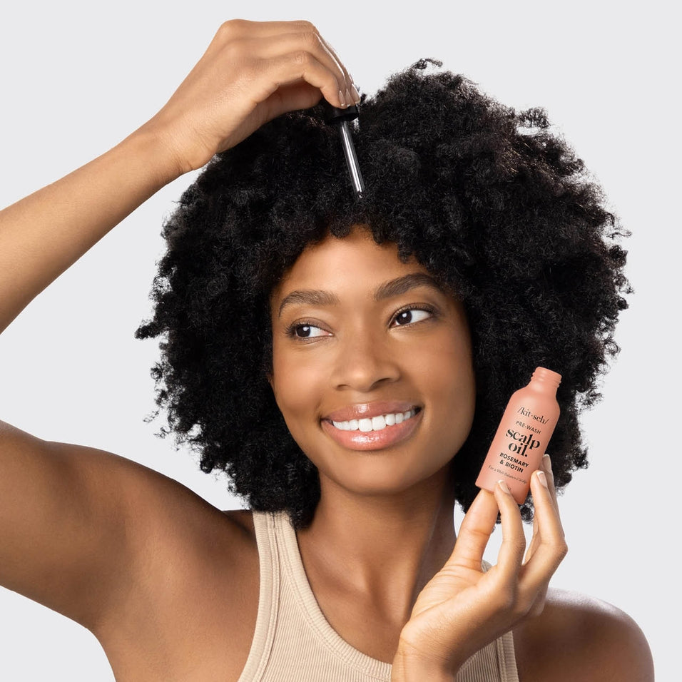 Bottle of Strengthening Hair & Scalp Oil with lavender scent in recyclable aluminum packaging.