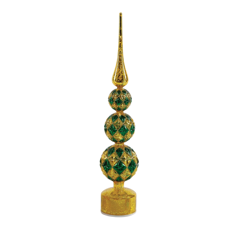 Revolving lit glass tree with gold and green diamond patterns on three stacked spheres and a spire.