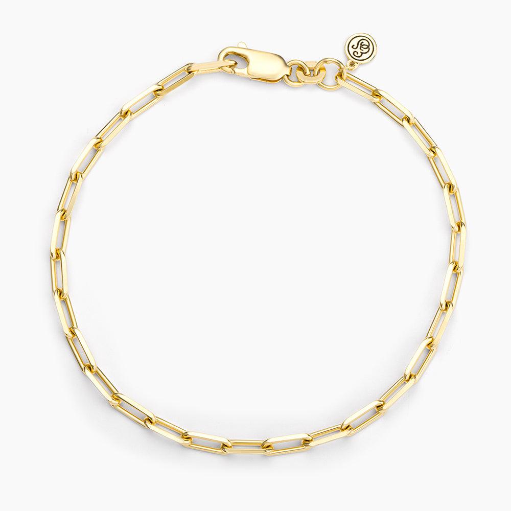 Mini paper clip chain bracelet in silver metal with a lobster clasp closure.