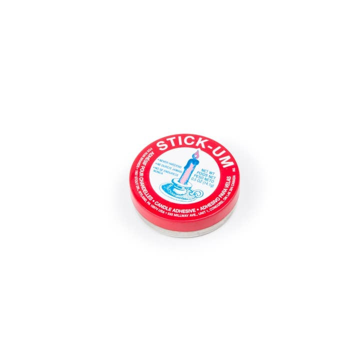 Small round tin of Fox Run Stick-Um Candle Adhesive in a neutral color.