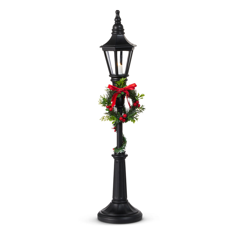 Black plastic lamp post with integrated lighting and a repeating six-hour timer.