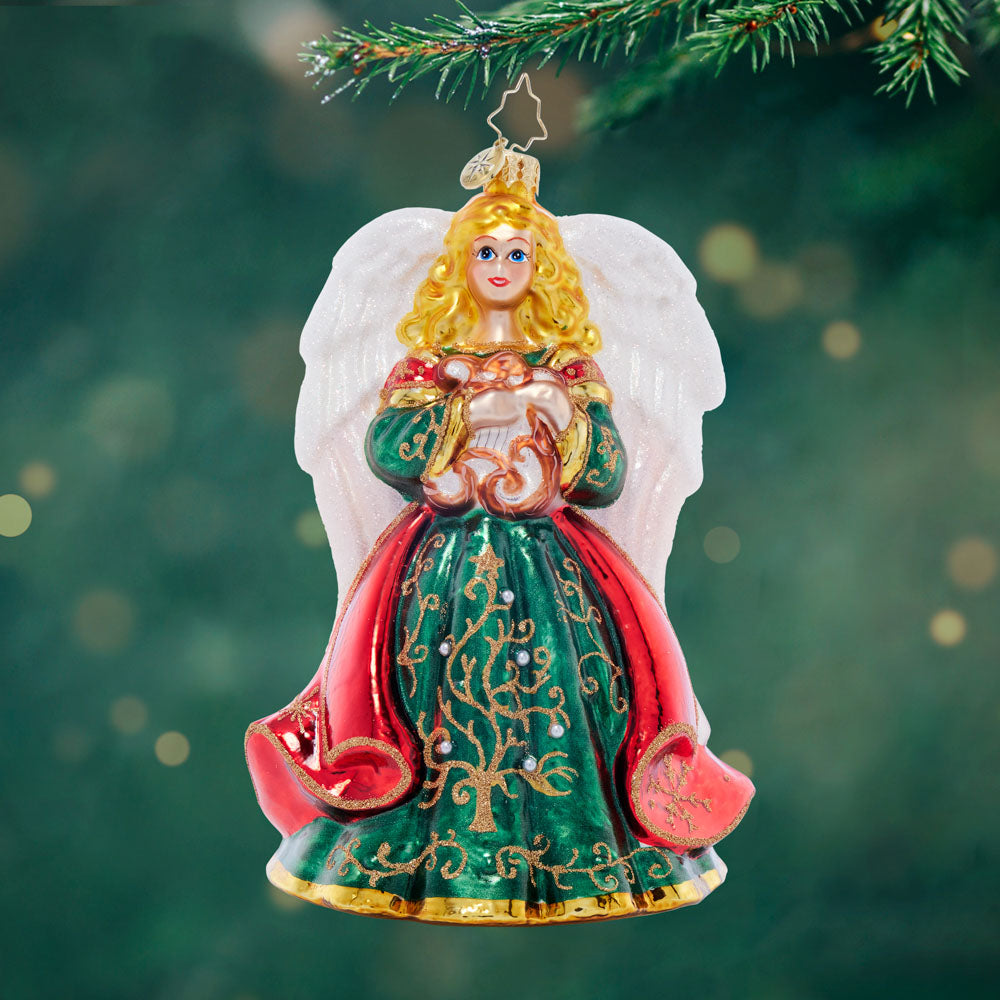 Heavenly Harpist glass angel ornament with green gown, red cape, and white wings holding a harp.