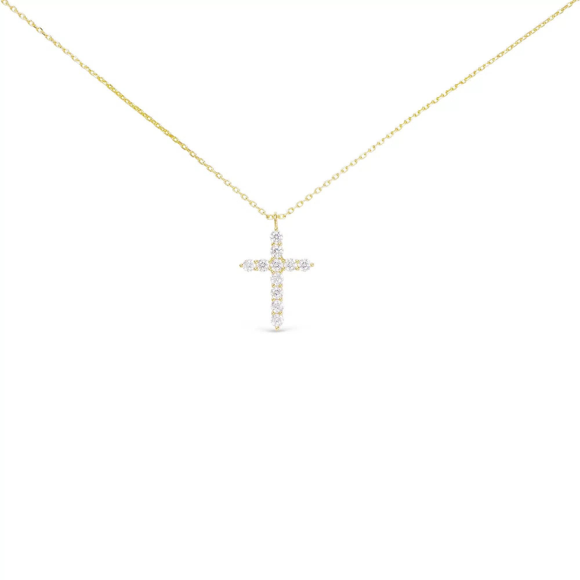 Gold chain necklace featuring a medium-sized cross pendant set with clear cubic zirconia stones.