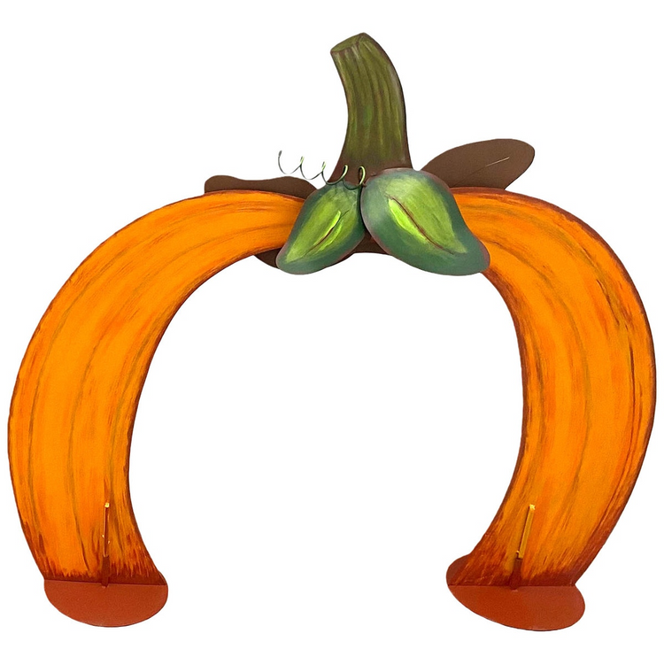 Metal tabletop pumpkin arch with orange sides, green leaves, and a brown stem on two flat bases.