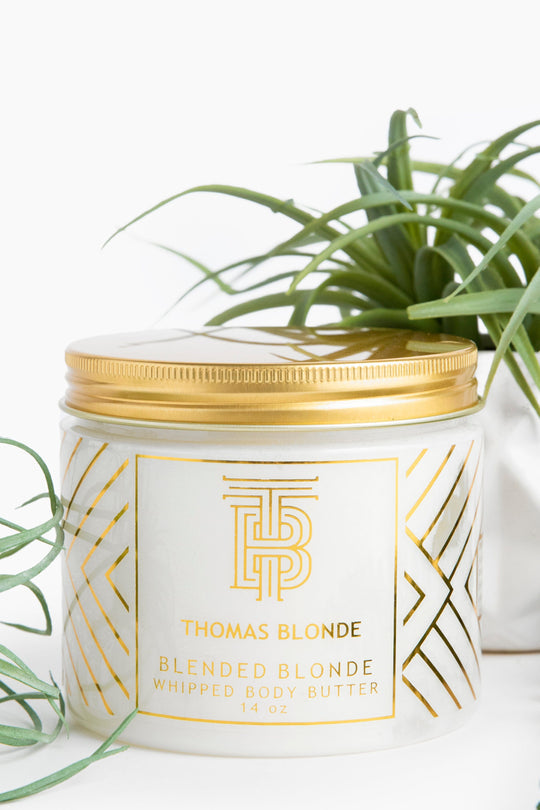 Thomas Blonde Blended Blonde Whipped Body Butter in a 14 oz white jar with a gold lid.