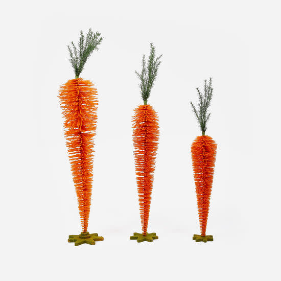 Standing carrot-shaped PVC display stand with a natural orange color.