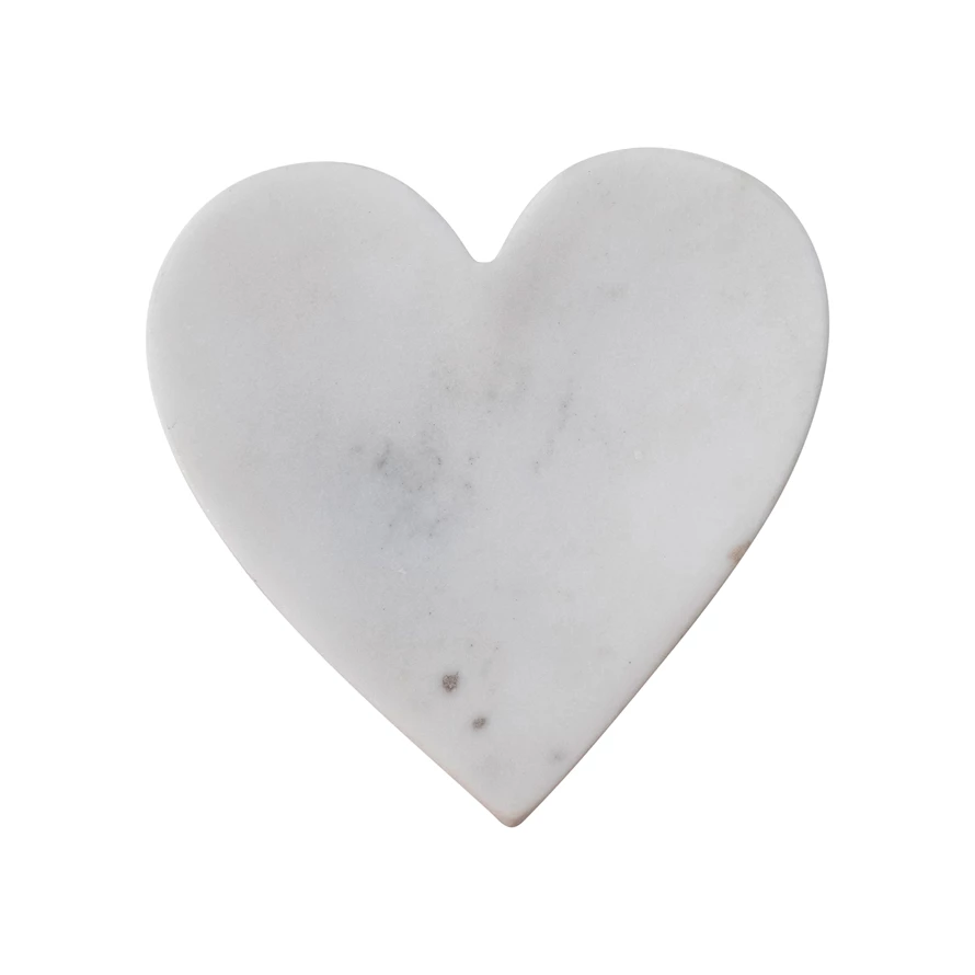 White marble heart-shaped dish with natural grey veining on a white background.
