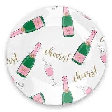 Round glass trinket tray with printed text on the bottom holding citrus garnishes.