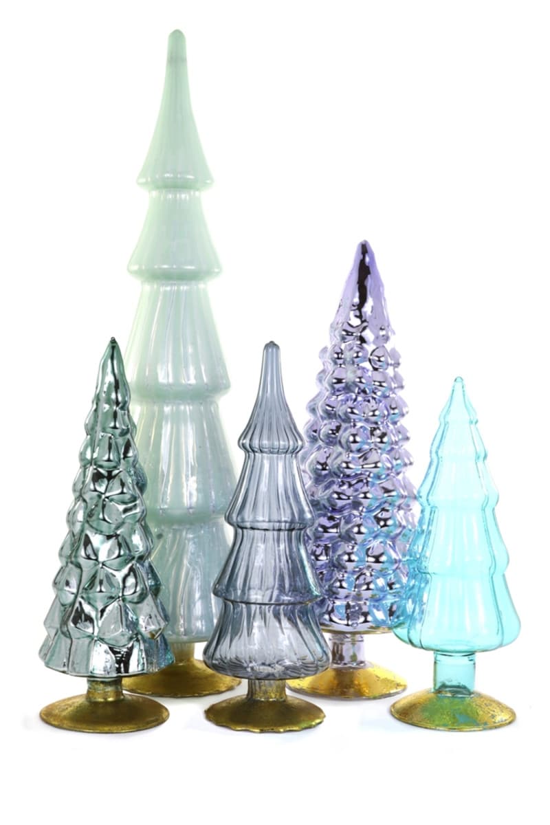 Glass candle holder shaped like a snow-covered tree with white accents.