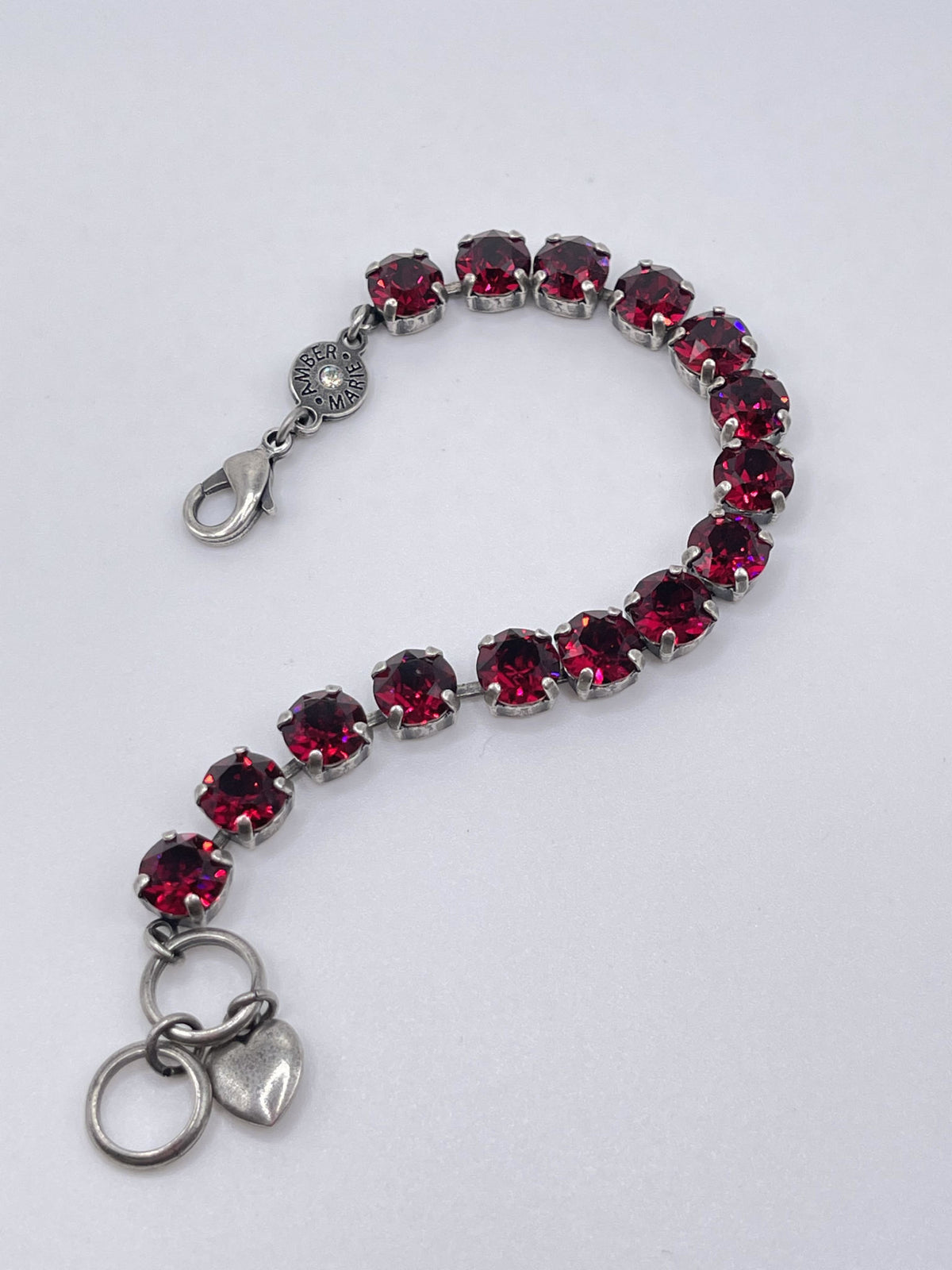 Classic Rome bracelet featuring deep red, black, and clear stones in a sleek silhouette.