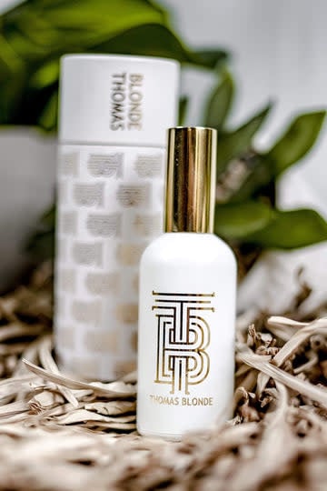Bottle of Room Re-Fresh Linen Spray in Canyon scent with a pump dispenser.