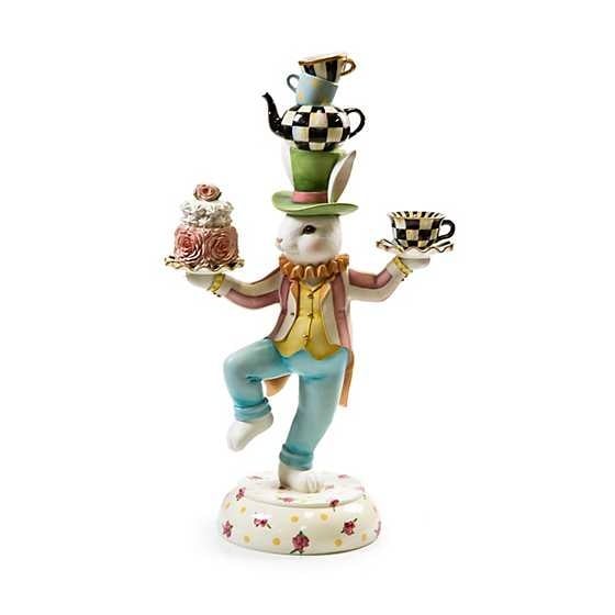 Hand-painted pastel resin bunny figurine on a cabbage rose base with tea party accessories.
