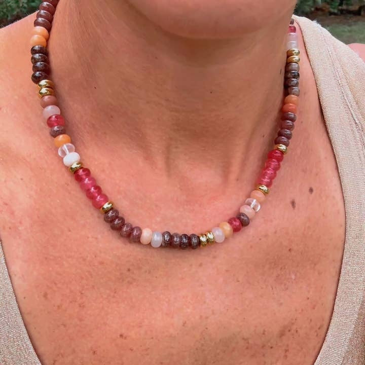 Adjustable gemstone necklace with rose pink, brown, peach, and gold colorblock dyed jade beads on a lobster clasp chain.