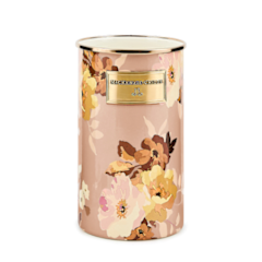 Rose-colored ceramic utensil holder with a cylindrical shape.