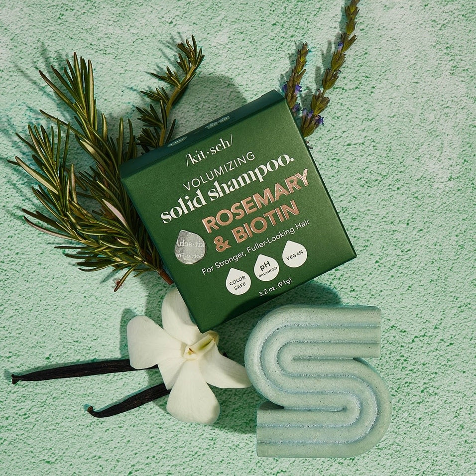 Rosemary & Biotin volumizing solid shampoo bar in a natural beige color with visible botanical speckles.