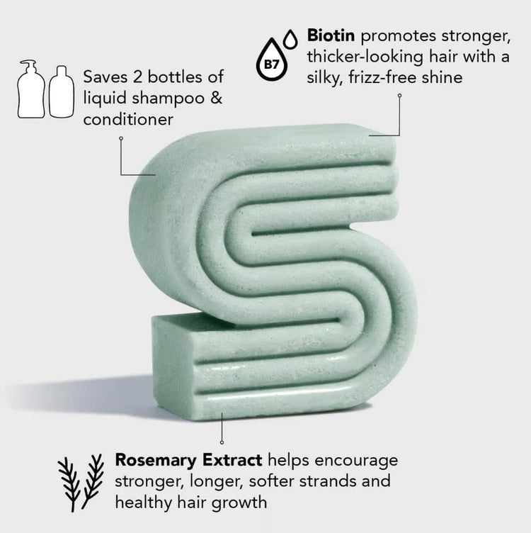 Rosemary & Biotin volumizing solid shampoo bar in a natural beige color with visible botanical speckles.