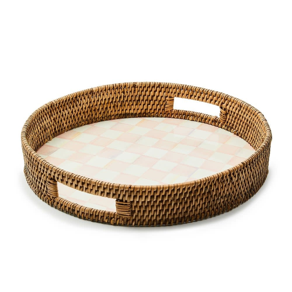 Round serving tray with hand-painted rosy check enamel on steel base rimmed by woven natural rattan.