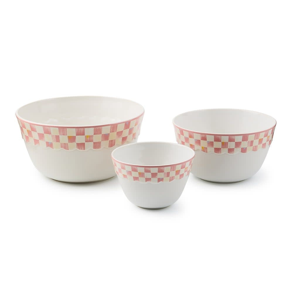 Rosy checkered stoneware mixing bowl with a rounded rim.