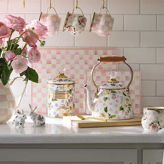 Set of two tempered glass cutting boards with rosy check floral pattern in small and large sizes.
