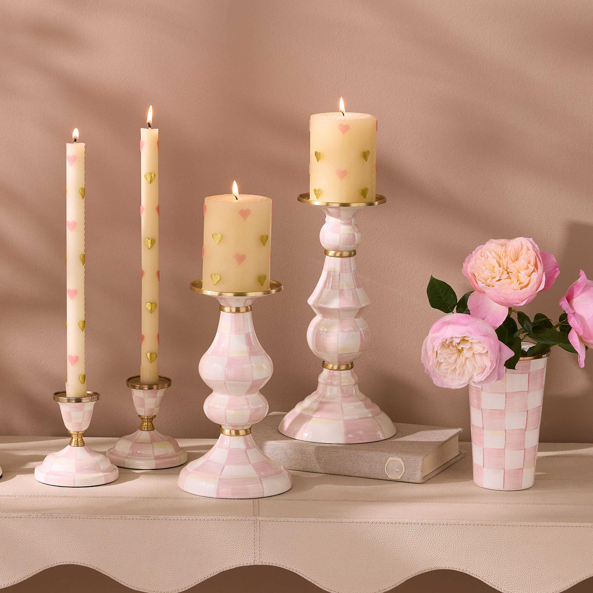 Hand-glazed steel pillar candlestick with rosy check pattern, brass accents, and bronzed stainless steel rim.