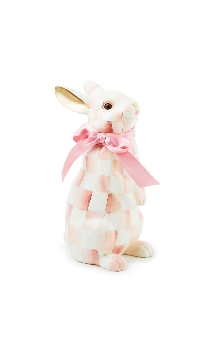Standing resin bunny figurine with rosy check ribbon pattern in pink tones.