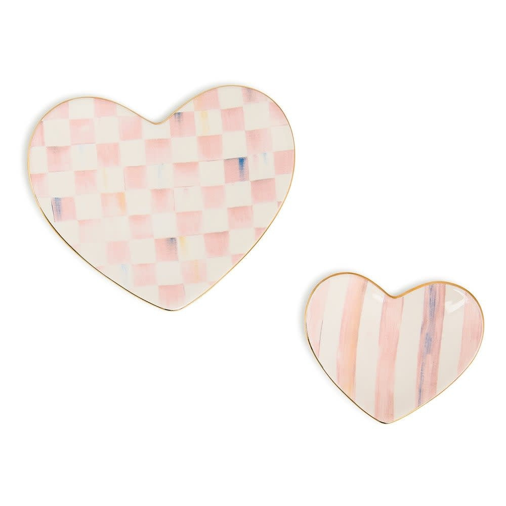 Ceramic trinket dish with a rosy heart decal on white background