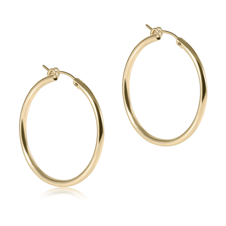 Round gold-filled hoop earring with a smooth finish and notch clasp closure.