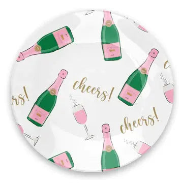 Round glass trinket tray with printed text on the bottom holding citrus garnishes.